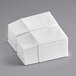 A stack of Touchstone by Choice white linen-feel paper napkins.