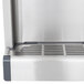 A close-up of a Crathco stainless steel refrigerated beverage dispenser.