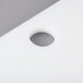 A white plastic ARY VacMaster filler plate with a hole in it.