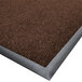 An Ultra-Berber brown carpet mat with a metal edge.