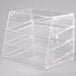 A clear plastic Cal-Mil U-Build pastry display case with three shelves.