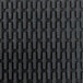 A close up of the black rubber surface of a Cactus Mat Ridge-Scraper safety mat.