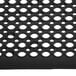 A black rubber Cactus Mat with holes in the middle.