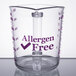 A purple Cambro polycarbonate measuring cup with the words "allergen free" on the counter.
