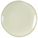 A white Tuxton china plate with a gold rim.