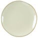 A white Tuxton china plate with a gold rim.