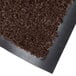 A roll of brown olefin carpet mat with a black backing.