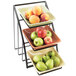 A Cal-Mil black square bowl display stand with trays of apples, pears, and peaches.