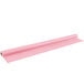 A roll of pink plastic table cover on a white background.