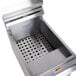 A stainless steel Cooking Performance Group fryer crumb and sediment tray on a counter.