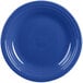 A close-up of a blue Fiesta dinner plate with a white rim.