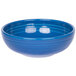 A blue bowl with a rippled surface and white interior.