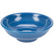 A blue bowl with a white surface and ripples on the edge.