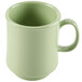 A close-up of a green GET Diamond Harvest mug with a handle.