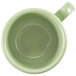 A green GET Diamond Harvest coffee mug with a handle.