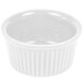A white fluted ramekin with a white background.