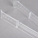 Clear plastic Fineline serving tongs with holes in the handles.