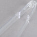 Clear plastic Fineline serving tongs.