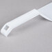 A Fineline white plastic spatula with a white handle.