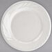 A Tuxton eggshell white china plate with an embossed white rim.