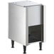 A silver rectangular Scotsman stainless steel ice dispenser stand with a white top shelf.