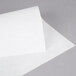 A close-up of white Heavy Duty Dry Wax Paper.