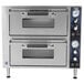 Two silver Waring double deck countertop pizza ovens with two doors.