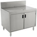 A stainless steel Advance Tabco drainboard cabinet with doors.