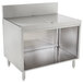 An Advance Tabco stainless steel drainboard cabinet with a shelf.