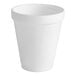 A close-up of a Dart white styrofoam cup.