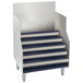An Advance Tabco stainless steel liquor display cabinet with blue metal stairs.