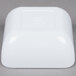 A white square GET Melamine Bowl on a gray surface.