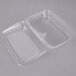 A 10" x 7" x 2" clear plastic tamper-evident take out container with a lid.