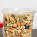 A Choice plastic deli container filled with pasta and vegetables.