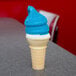 A blue ice cream cone with Phillips Blue Raspberry shell coating.