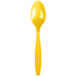 A Creative Converting yellow heavy weight plastic spoon with a white background.