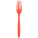A close up of a Creative Converting coral orange plastic fork with a bright orange handle.