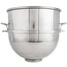 A large silver stainless steel Vollrath mixing bowl with handles.