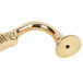 A curved gold plated brass side handle for a chafer.