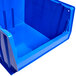 A blue plastic bin with a white background.