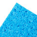 A close up of a blue 3M Scotch-Brite soft scour scrub sponge.