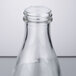 A close-up of a clear glass Town Red Top Soy Sauce bottle.