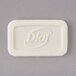 A close-up of a white rectangular Dial soap bar with text on it.