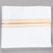 A white cloth napkin with gold stripes.