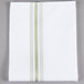 A white Snap Drape cloth napkin with green stripes.