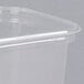 A close-up of a D&W Fine Pack clear plastic deli container with a lid.