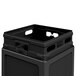 A black plastic Commercial Zone waste container with a dome lid.