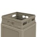 A beige plastic Commercial Zone waste container with a dome lid.