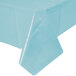 A Creative Converting pastel blue plastic table cover on a table.