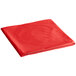 A red folded table cover on a white background.